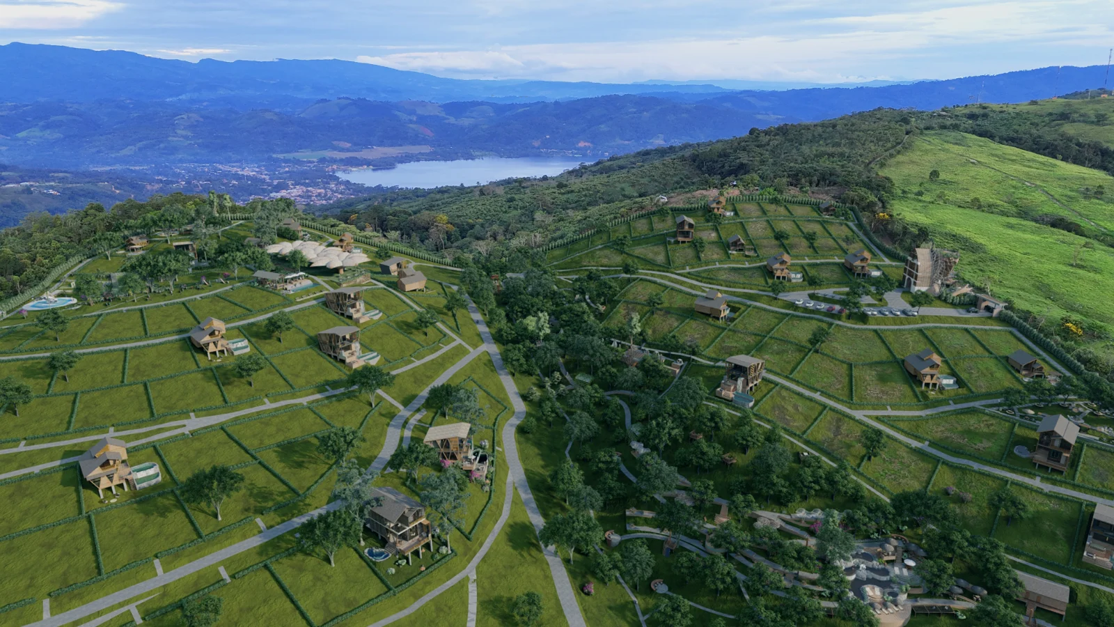 Vista aérea del proyecto NUNA con lotes, cabañas y vista a la Laguna Azul